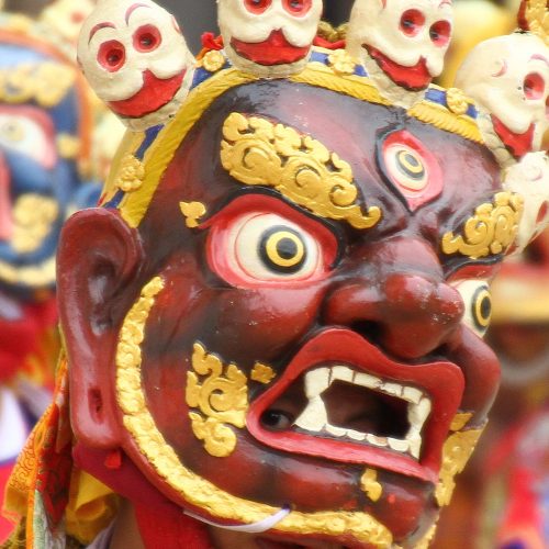 Gentle eyes behind a wrathful mask